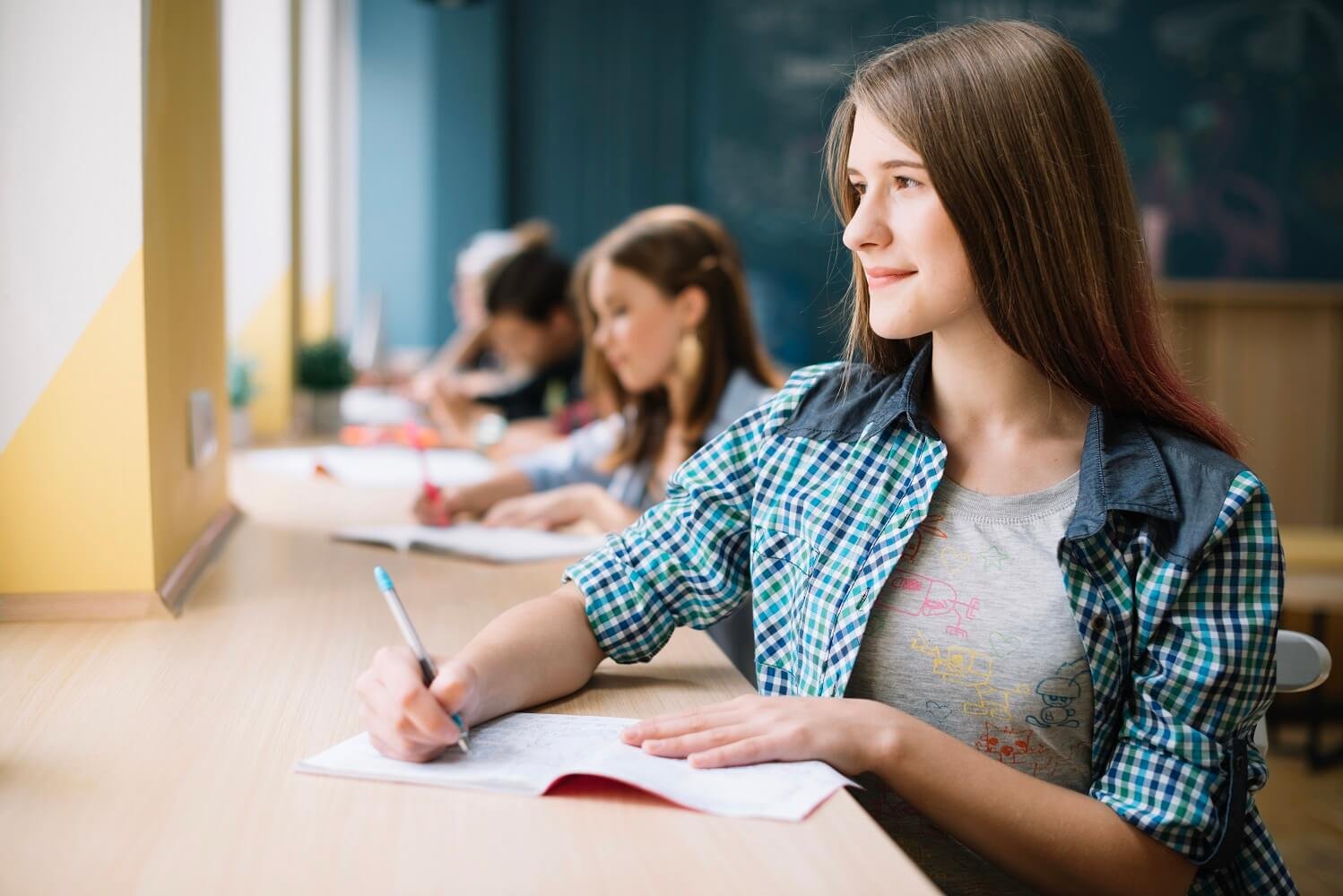 pensive-girl-writing-looking-away (1)